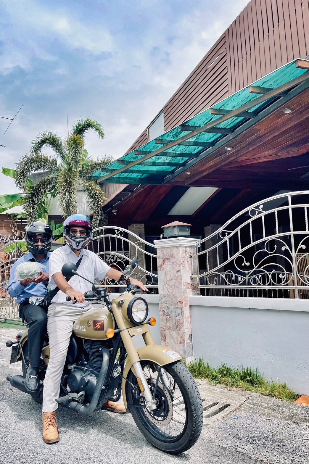 Two friends ready for a motorbike ride through Phatthalung
