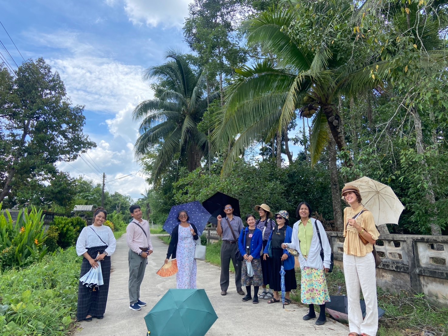 Congregation friends walking together through the Phatthalung countryside