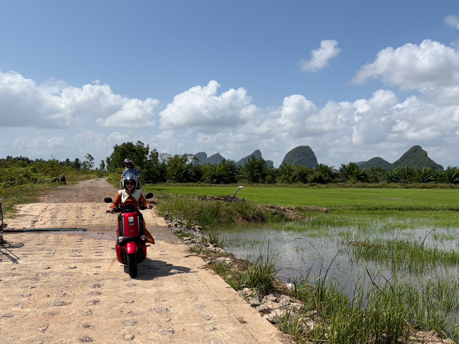 Friends riding through the Phatthalung countryside