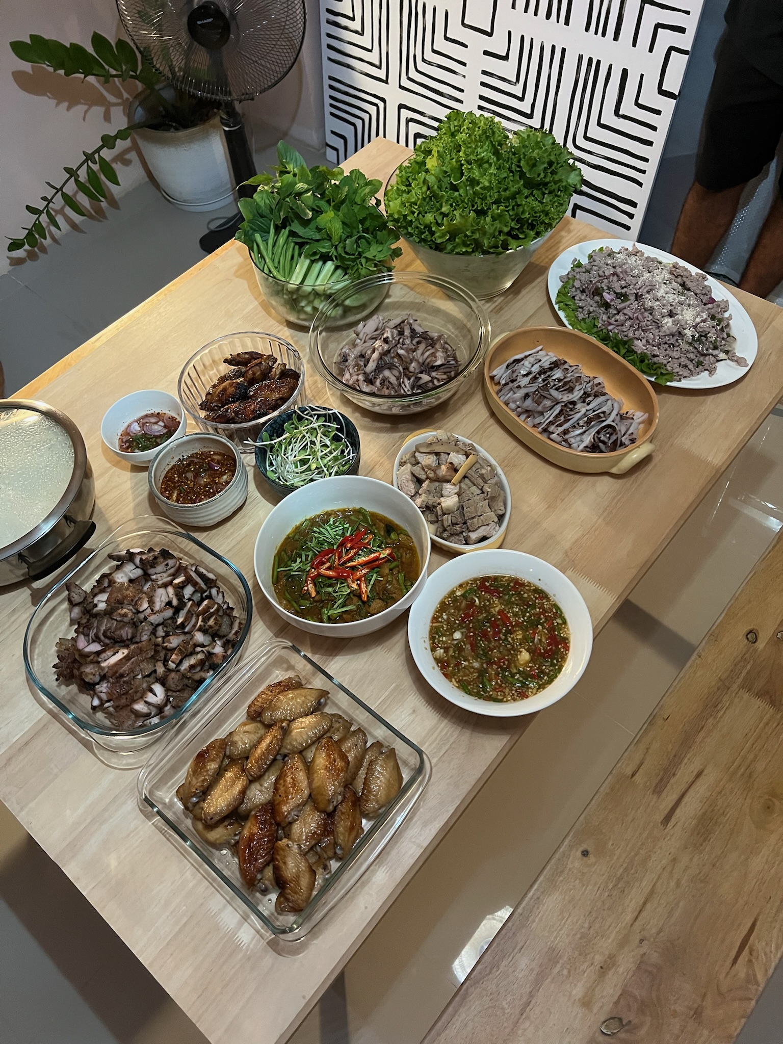 A generous Thai meal prepared to share with friends