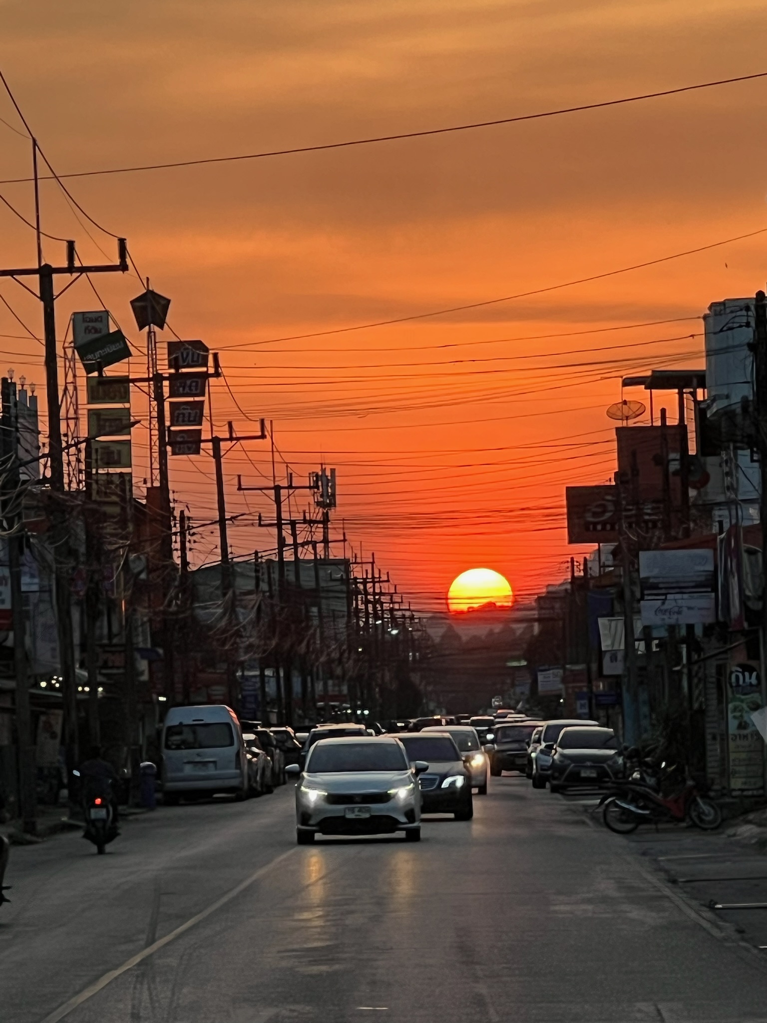 A vivid sunset glowing above Phatthalung town